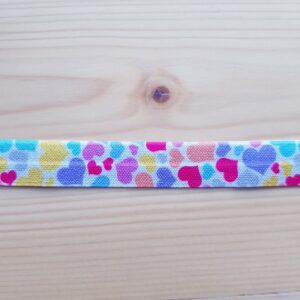 Weiches Faltgummi, elastisches Einfassband, 16 mm, weiss mit bunten Herzen